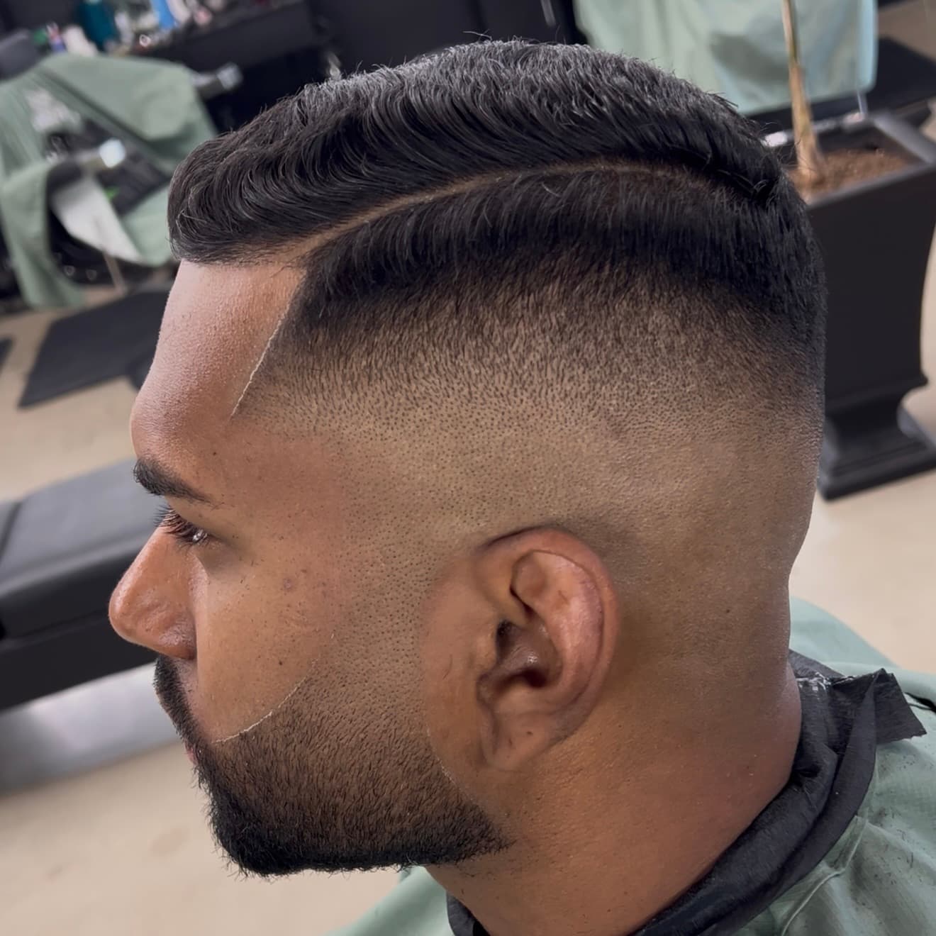 Sharp skin fade with crop top at Mike Drop Fades Cypress